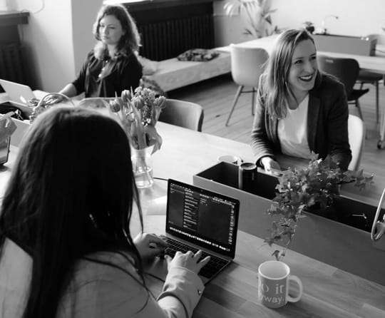 group of coworkers enjoying a meeting